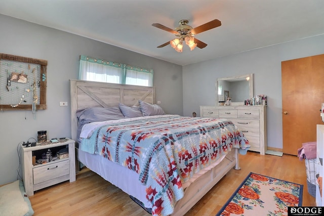 bedroom featuring ceiling fan and light hardwood / wood-style flooring