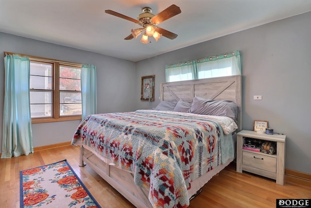 bedroom featuring ceiling fan and light hardwood / wood-style flooring