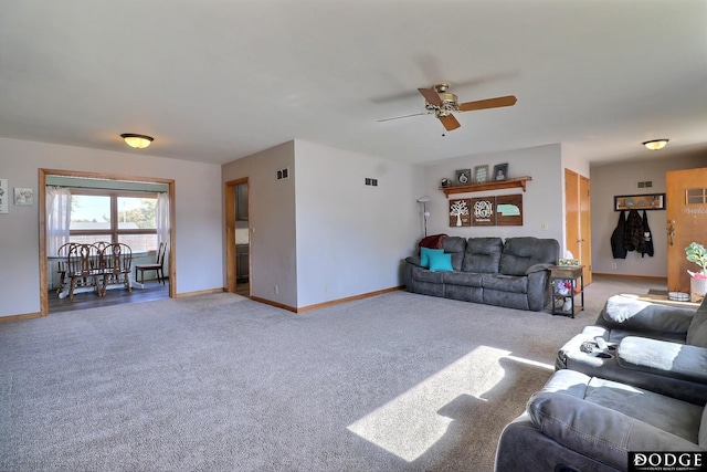 living room with light carpet and ceiling fan