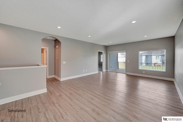 spare room featuring light hardwood / wood-style flooring