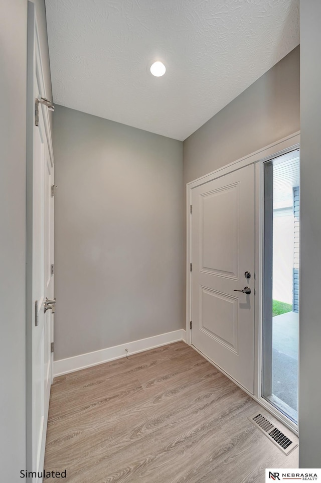 foyer featuring light hardwood / wood-style floors