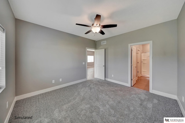 unfurnished bedroom with ceiling fan and light carpet