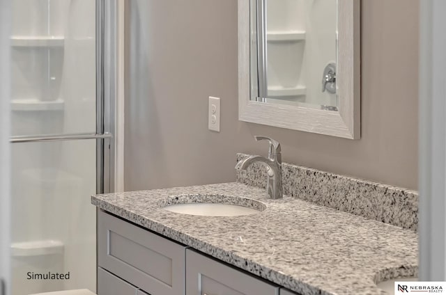 bathroom featuring vanity and walk in shower