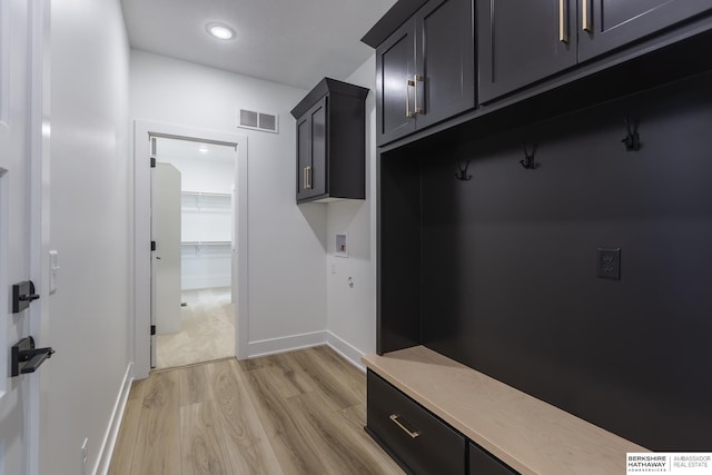 mudroom with light hardwood / wood-style flooring