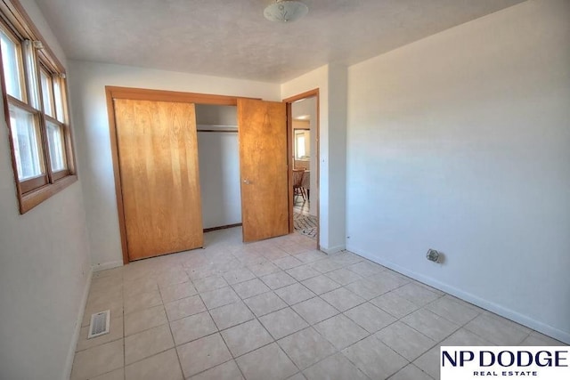 unfurnished bedroom featuring a closet