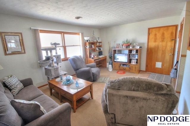 living room with light colored carpet and a textured ceiling