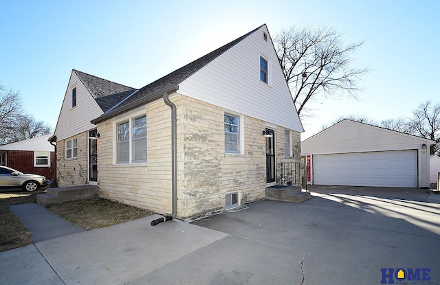 view of side of home featuring an outbuilding and a garage