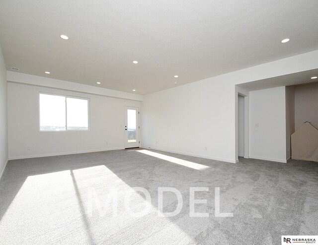 14803 Willow St, Bennington, NE 68007 - spare room featuring carpet floors, recessed lighting, and baseboards