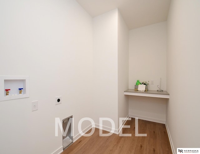 14803 Willow St, Bennington, NE 68007 - laundry room featuring electric dryer hookup, light wood-type flooring, hookup for a washing machine, and baseboards
