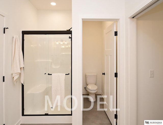 14803 Willow St, Bennington, NE 68007 - bathroom featuring a stall shower, toilet, recessed lighting, and baseboards