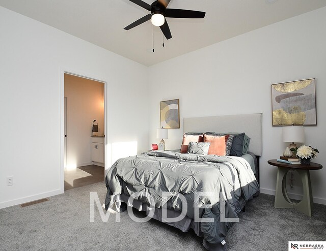 14803 Willow St, Bennington, NE 68007 - carpeted bedroom with baseboards, connected bathroom, and ceiling fan
