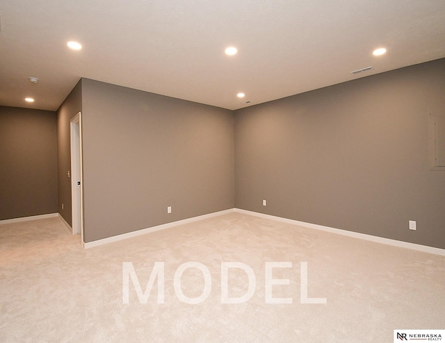 14803 Willow St, Bennington, NE 68007 - below grade area with light colored carpet, recessed lighting, and baseboards