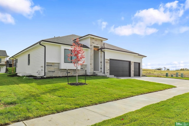 view of front of house featuring a garage and a front yard