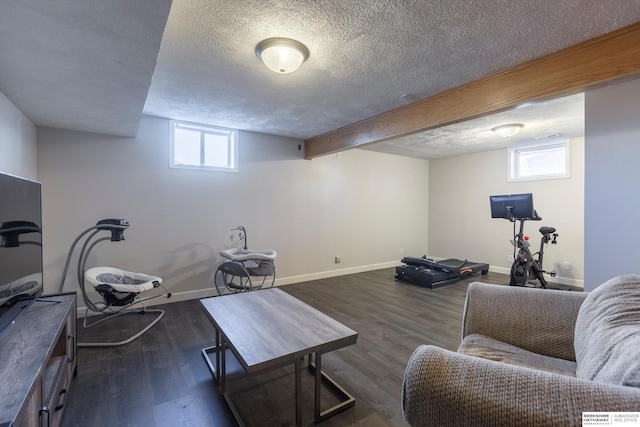 living room with dark hardwood / wood-style flooring and a textured ceiling