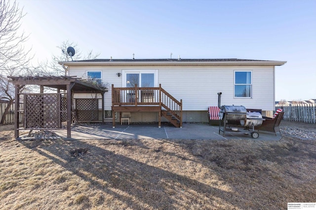 back of house featuring a pergola, a patio, and a deck