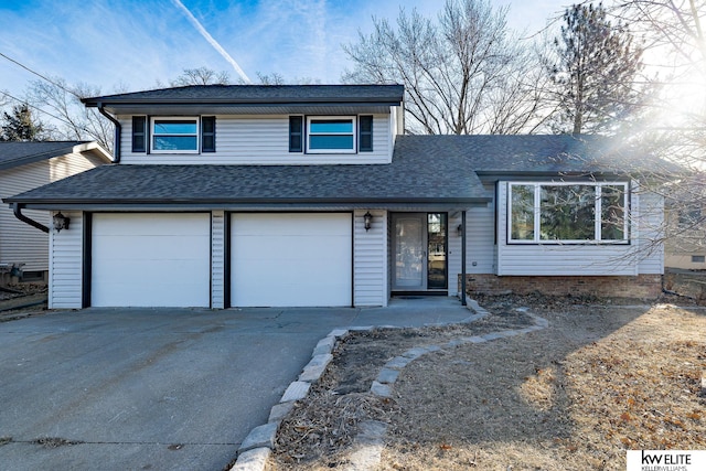 view of front of property with a garage