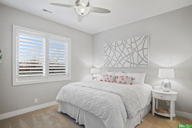 bedroom with light colored carpet and ceiling fan