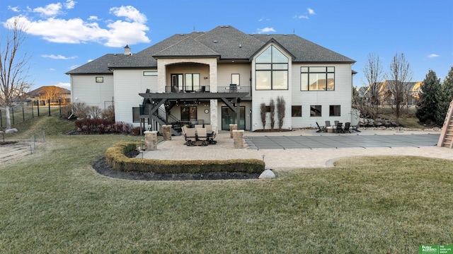 back of property featuring a patio and a yard