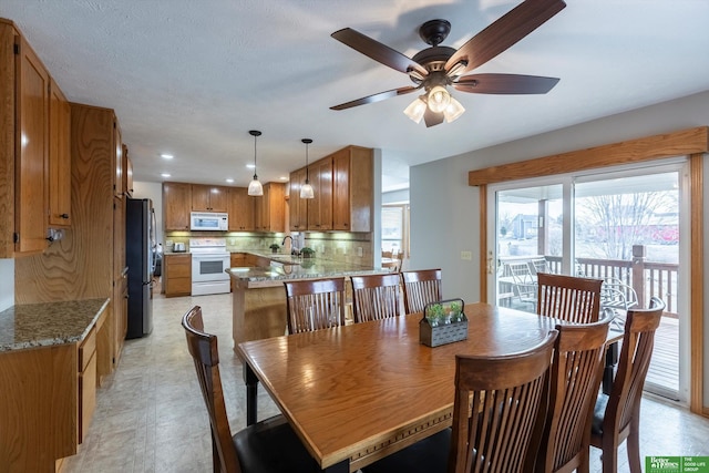 dining space featuring sink