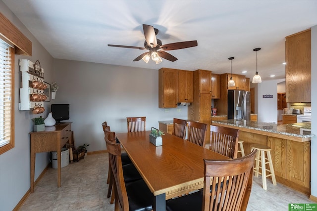 dining space with ceiling fan