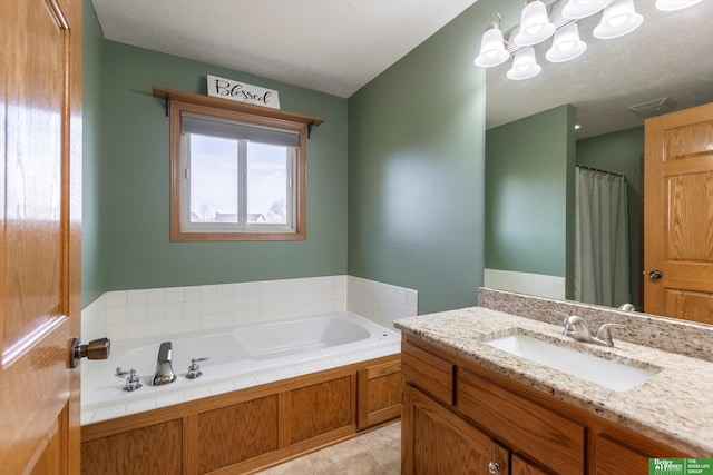 bathroom featuring vanity and a bathing tub