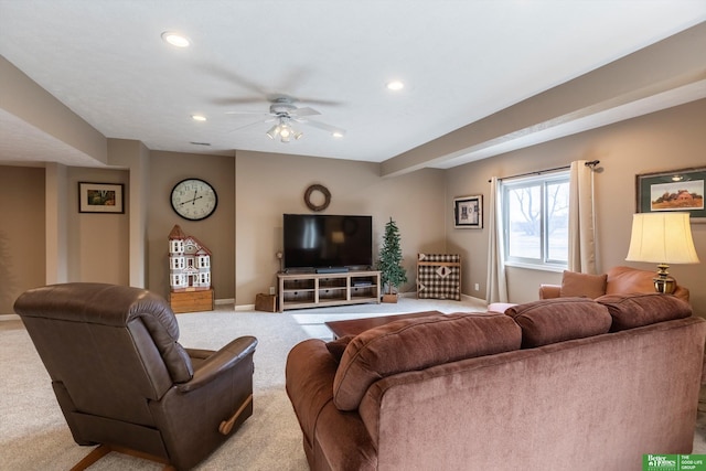 carpeted living room featuring ceiling fan