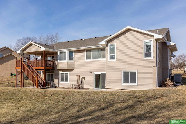 back of house with central AC unit, a yard, a patio area, and a deck