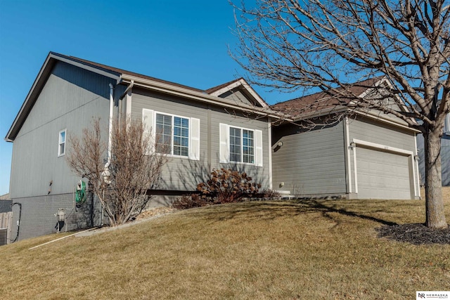 ranch-style home featuring a garage and a front yard