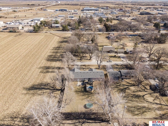 birds eye view of property with a rural view