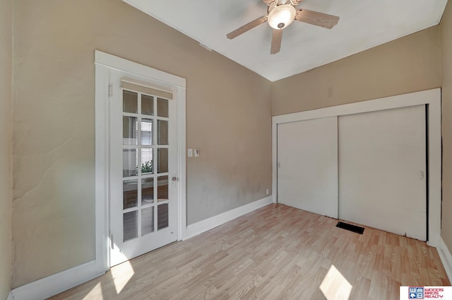 unfurnished bedroom featuring a closet, ceiling fan, and light wood-type flooring