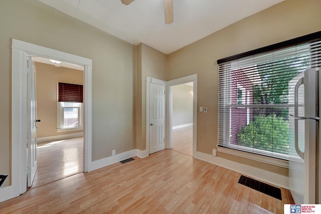 unfurnished room with ceiling fan and light hardwood / wood-style flooring