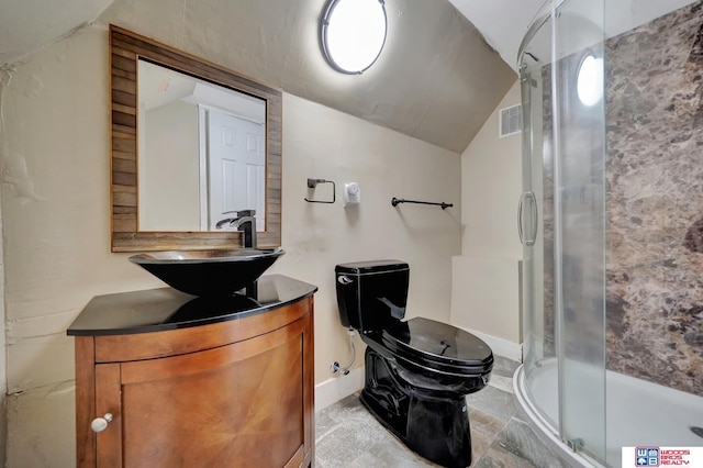 bathroom with vanity, a shower with shower door, toilet, and vaulted ceiling