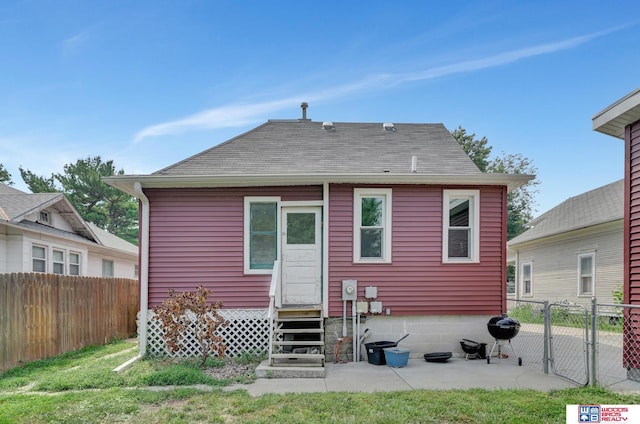 rear view of property featuring a patio area