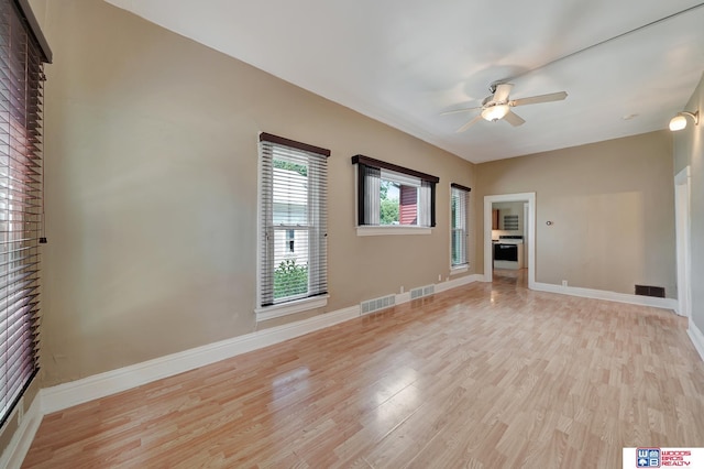 spare room featuring ceiling fan and light wood-type flooring