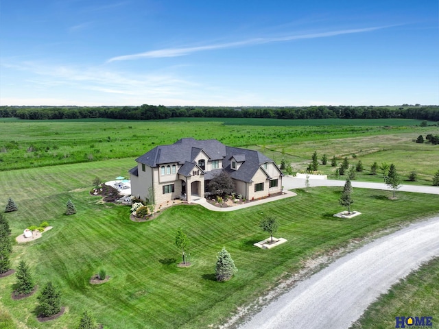 birds eye view of property with a rural view