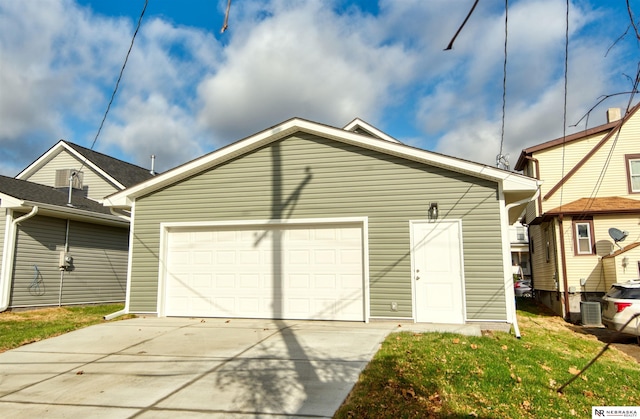 garage featuring a yard