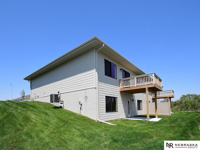 14806 Bruning St, Bennington, NE 68007 - rear view of property with central air condition unit, a wooden deck, and a yard