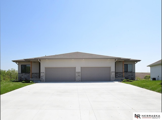 14806 Bruning St, Bennington, NE 68007 - prairie-style house with an attached garage, concrete driveway, and stone siding