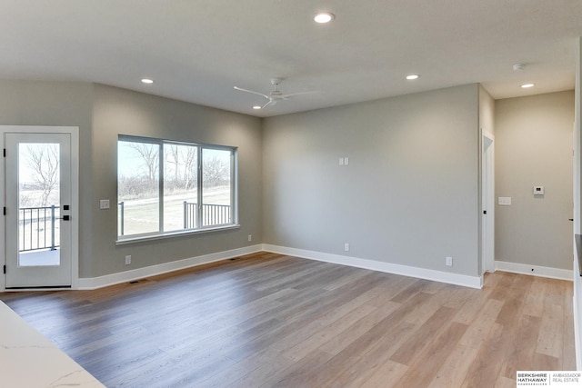 interior space with ceiling fan and light hardwood / wood-style flooring