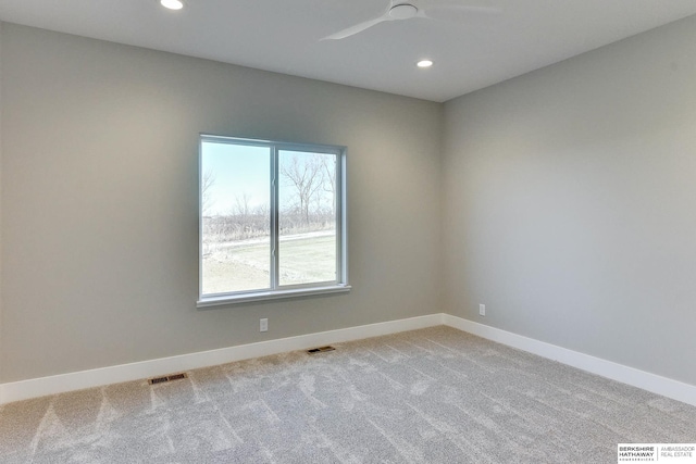 carpeted empty room with ceiling fan