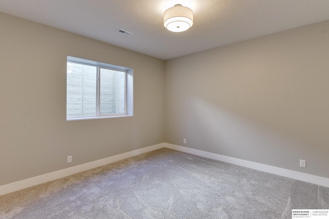 empty room with carpet flooring