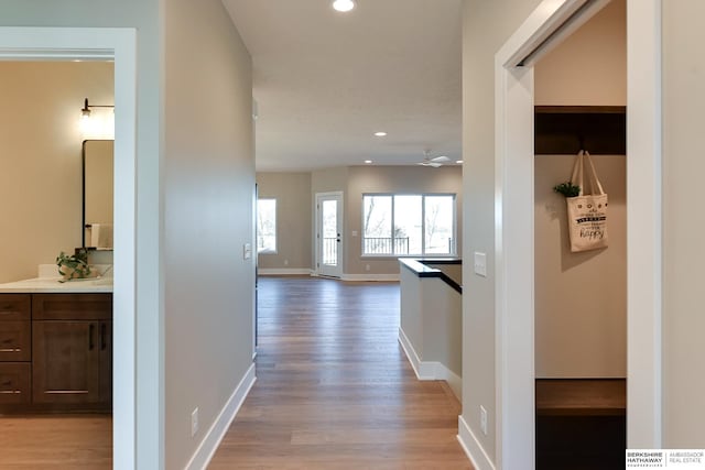 hallway with light wood-type flooring