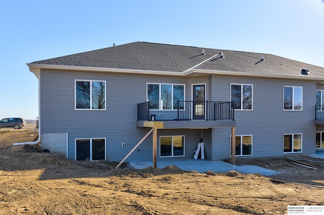 back of property with a patio area and a balcony