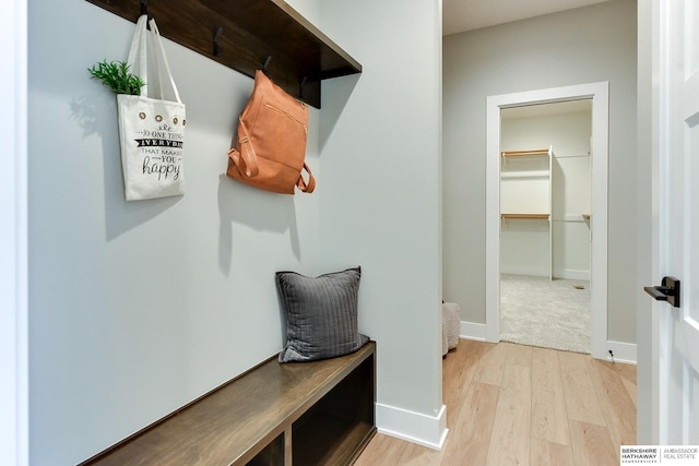 mudroom with light hardwood / wood-style floors