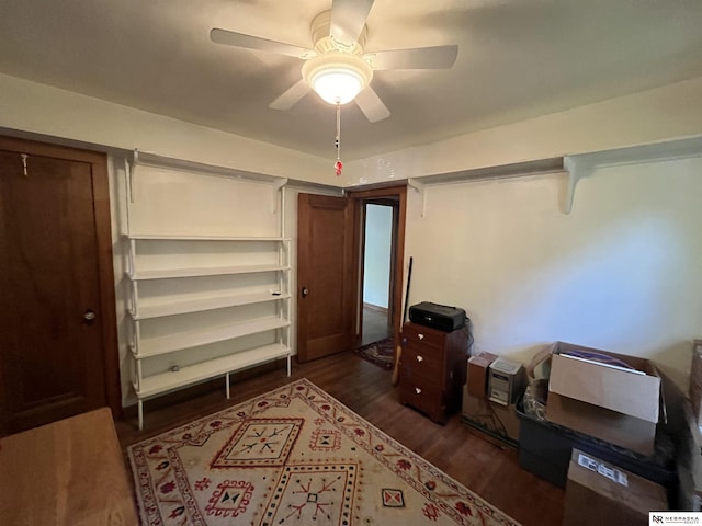 bedroom with ceiling fan and dark hardwood / wood-style flooring