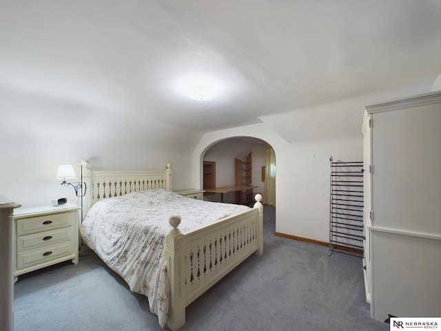 carpeted bedroom featuring vaulted ceiling