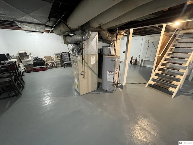 basement featuring gas water heater and heating unit