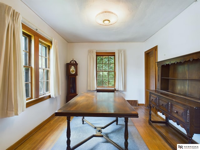 office space with wood-type flooring