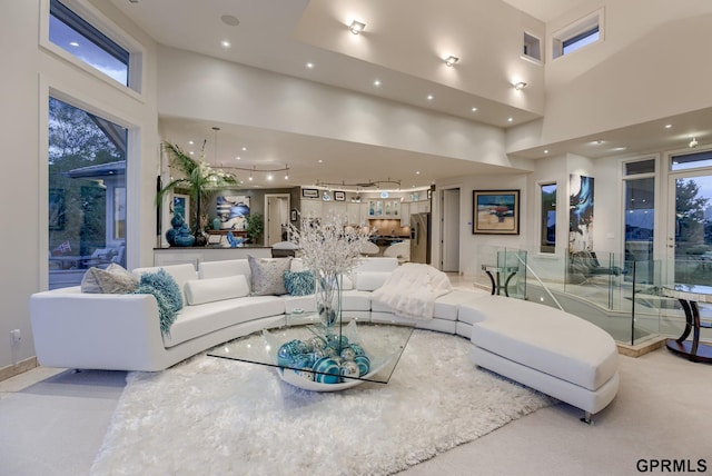 living room with a towering ceiling