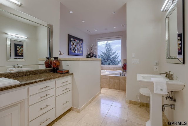 bathroom featuring a relaxing tiled tub and tile patterned floors